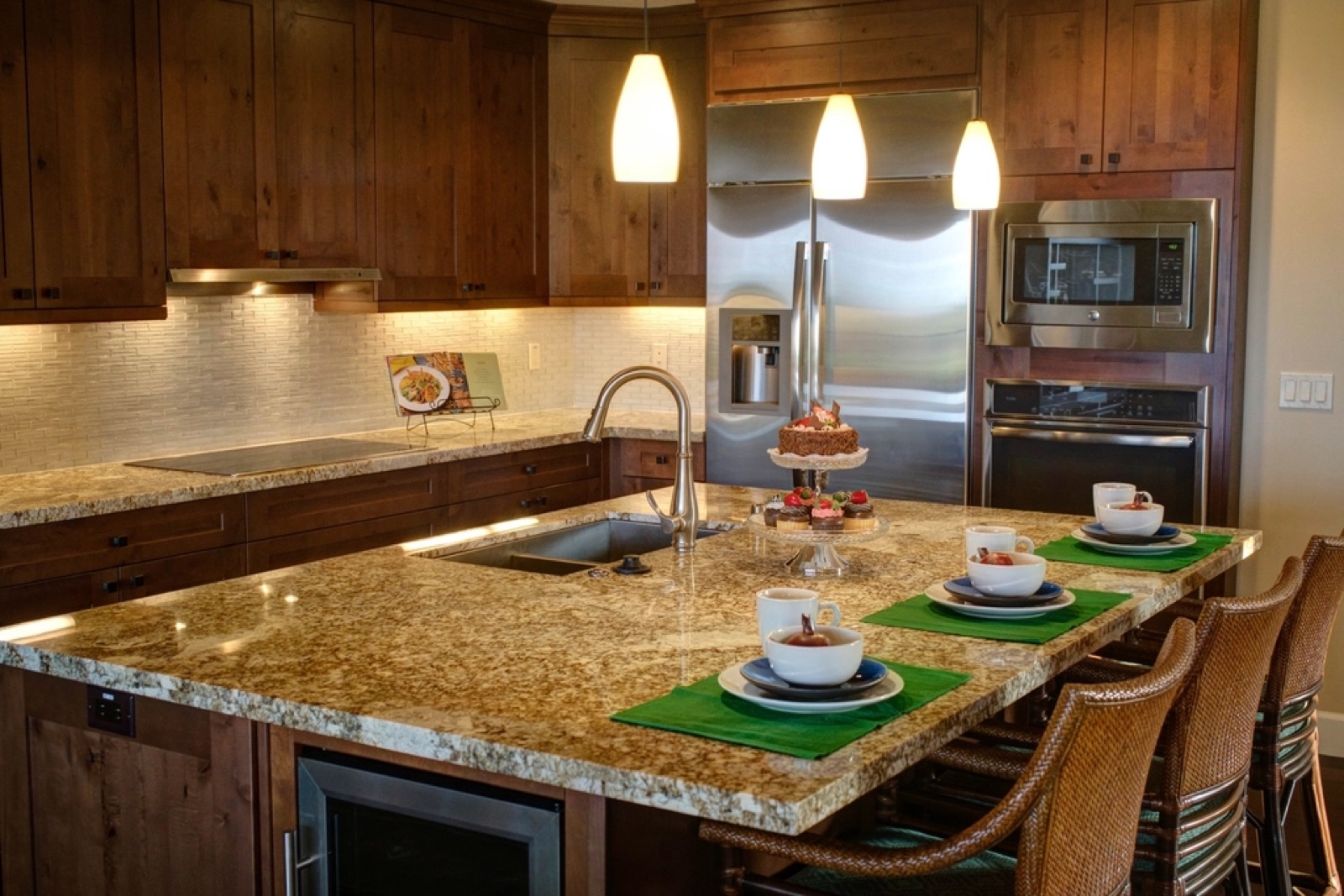 Remodeled Port St. Lucie kitchen with a granite island, bar stools and place settings