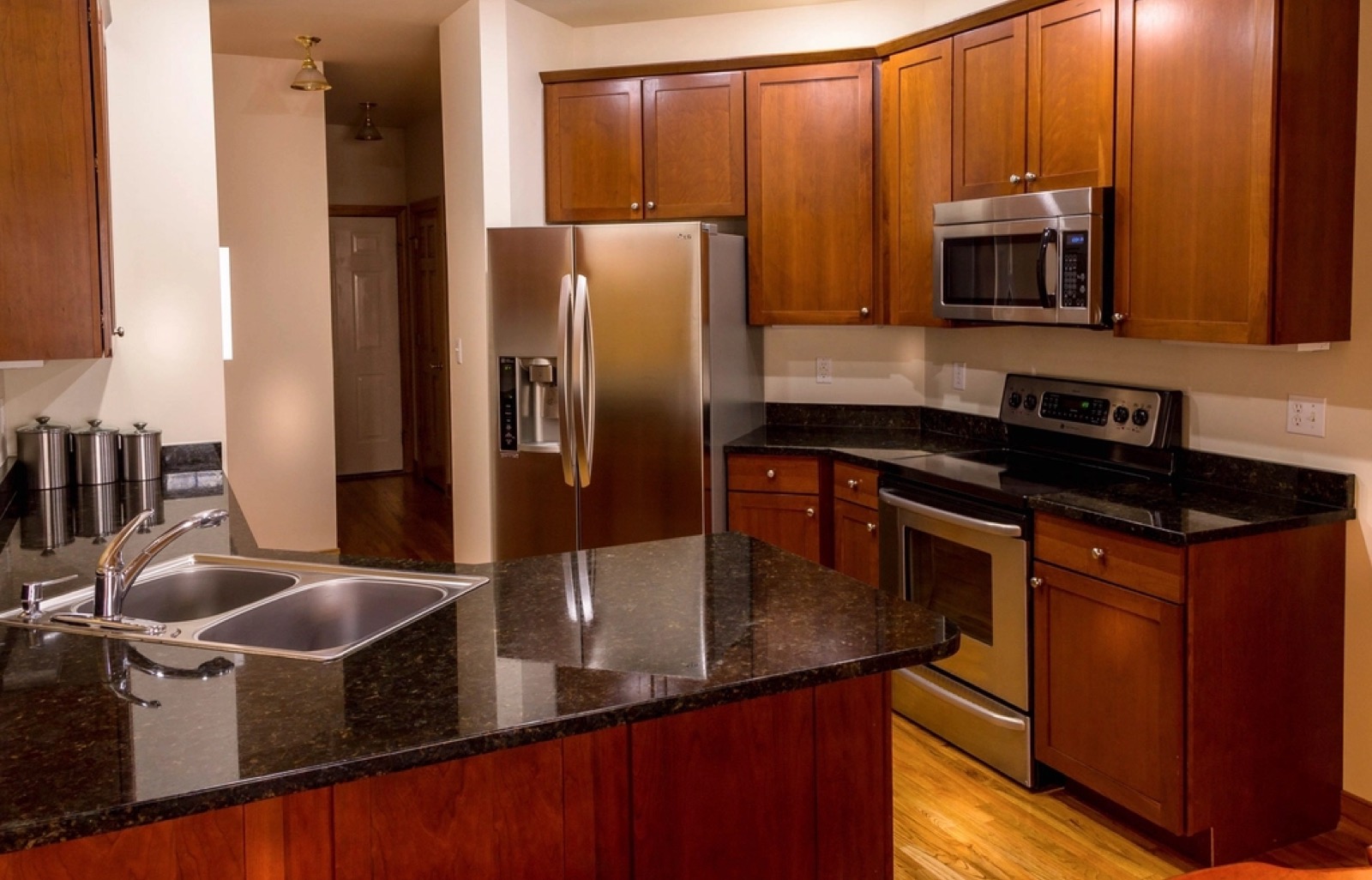 Custom wood cabinets with stainless appliances in a Port St. Lucie kitchen